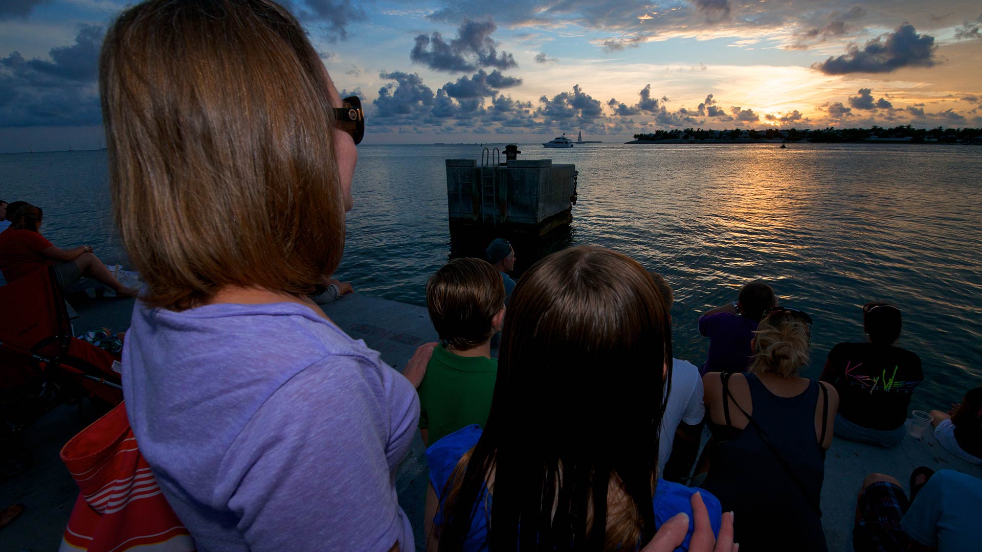 mom and child watching sunset at mallory square