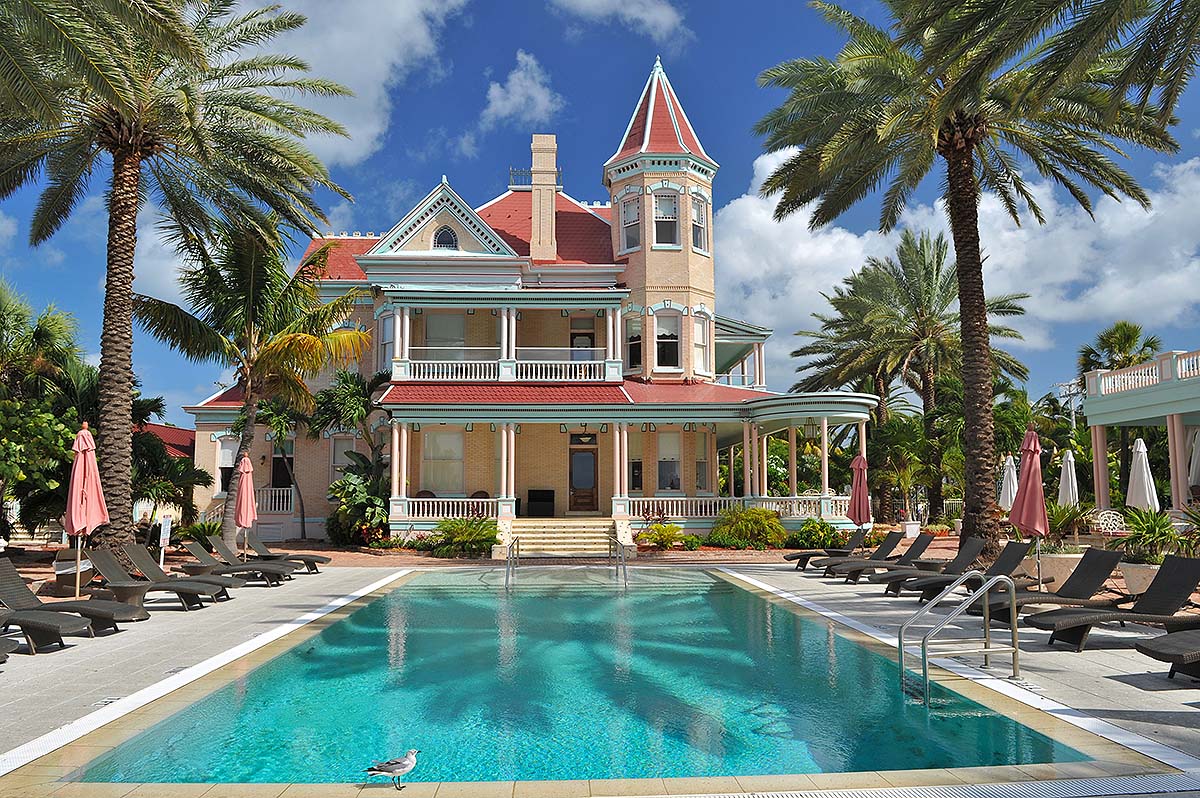 Victorian mansions with intricate architecture and lush gardens